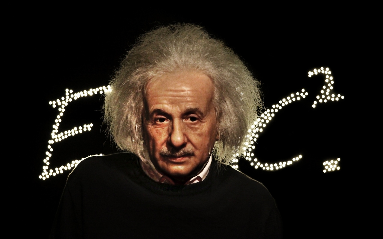 Einstein standing with E=mc2